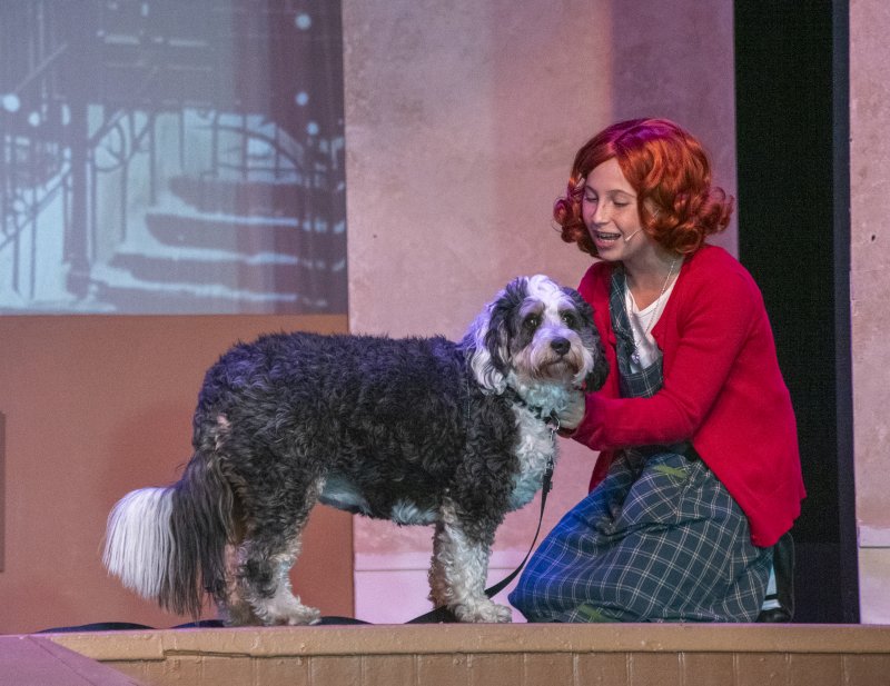 On the Clear Space Theatre stage, Annie, played by Cecilia Sydell, sings to her beloved dog, Sandy. SUBMITTED PHOTO